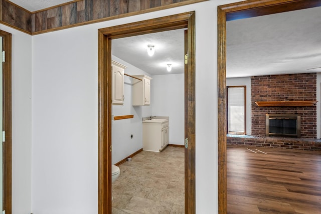 3131 E Southern Hills Blvd, Springfield, MO 65804 - hall featuring baseboards and a sink