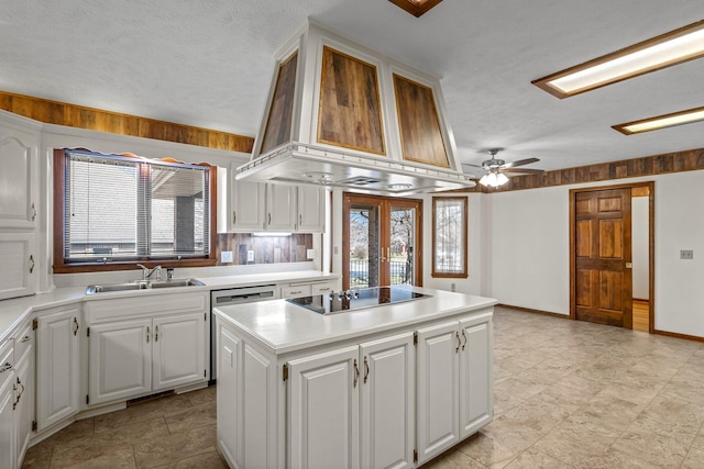 3131 E Southern Hills Blvd, Springfield, MO 65804 - kitchen with black electric cooktop, a sink, wall chimney range hood, light countertops, and a kitchen island