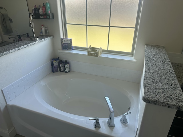 bathroom with a garden tub