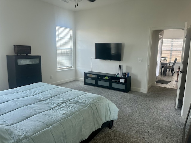 bedroom featuring baseboards and carpet flooring