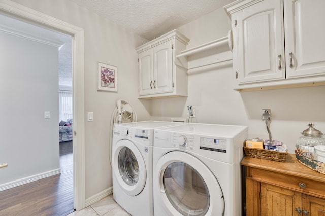 4040 E Windsong St, Springfield, MO 65809 - washroom with cabinet space, baseboards, and separate washer and dryer