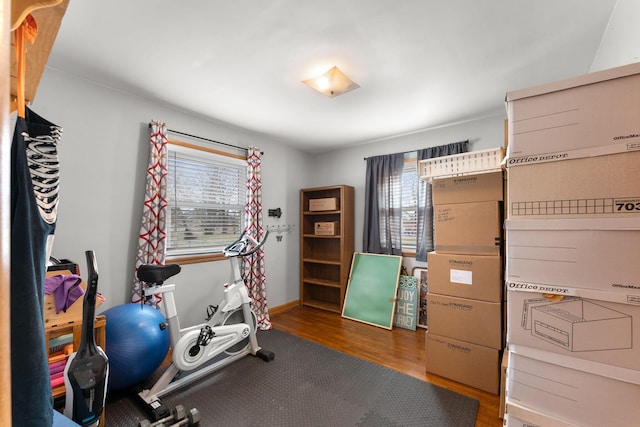 exercise room with wood finished floors