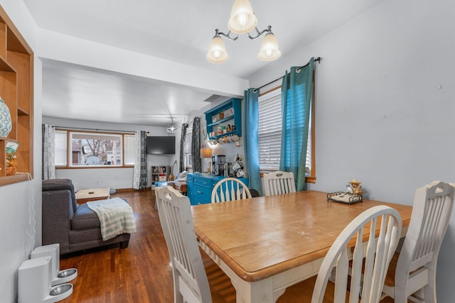 dining room featuring a chandelier and wood finished floors