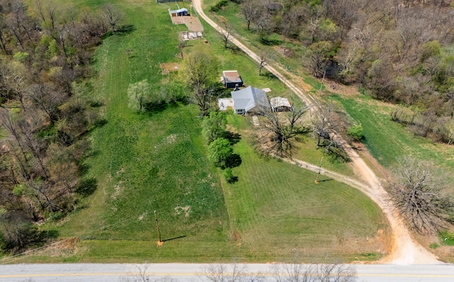 birds eye view of property with a rural view