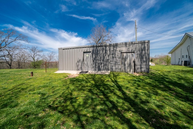 view of outbuilding featuring central AC unit and an outdoor structure