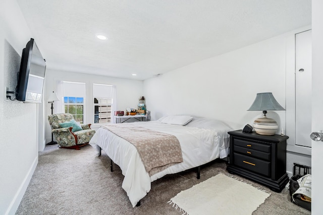 bedroom with recessed lighting, baseboards, and carpet floors