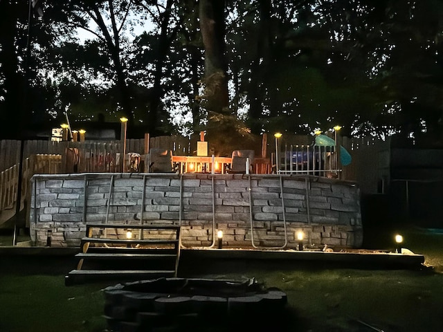 view of community featuring fence