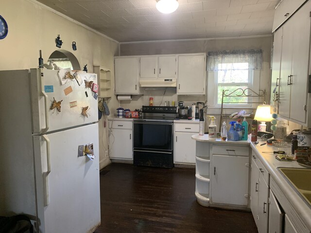 kitchen with freestanding refrigerator, dark wood-style floors, under cabinet range hood, white cabinetry, and electric range