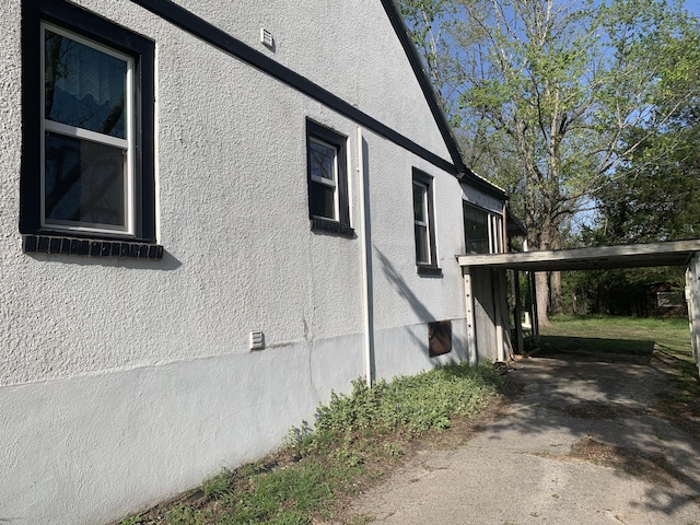 view of home's exterior featuring crawl space and stucco siding
