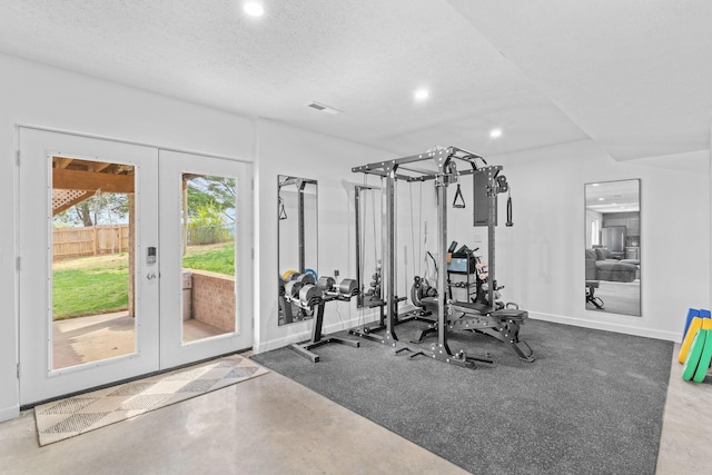exercise area featuring a textured ceiling, visible vents, recessed lighting, french doors, and baseboards