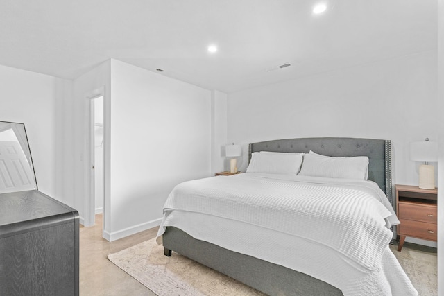bedroom with recessed lighting, visible vents, baseboards, and concrete flooring