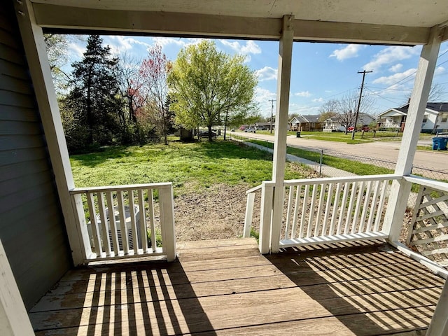 2151 N Weller Ave, Springfield, MO 65803 - deck with covered porch, a residential view, and a lawn