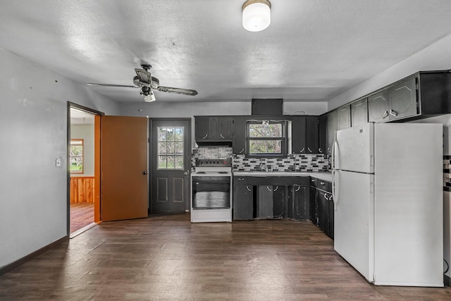 528 S Chicago Ave, Bolivar, MO 65613 - kitchen with dark wood-style flooring, tasteful backsplash, freestanding refrigerator, ceiling fan, and electric range oven