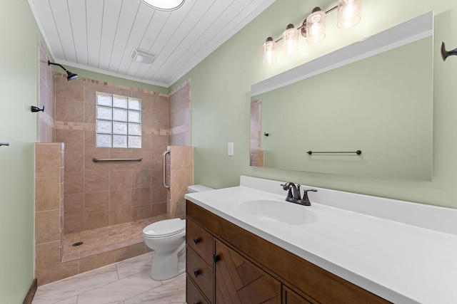 full bathroom with a tile shower, marble finish floor, vanity, and toilet