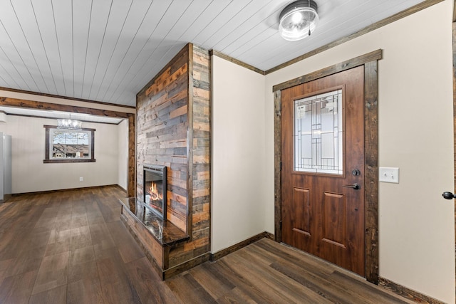entryway with a fireplace, dark wood-type flooring, baseboards, and wooden ceiling
