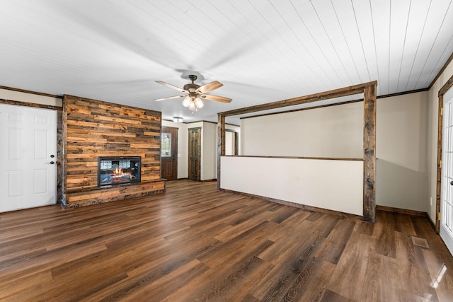 unfurnished living room with a large fireplace, baseboards, a ceiling fan, and wood finished floors