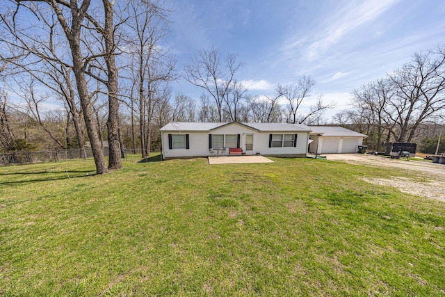 15601 County Road 281, Wheatland, MO 65779 - ranch-style home with driveway, a front yard, a garage, metal roof, and fence