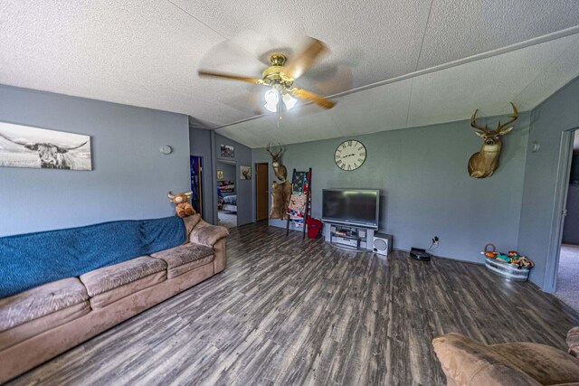 15601 County Road 281, Wheatland, MO 65779 - living room with a textured ceiling, wood finished floors, a ceiling fan, and lofted ceiling