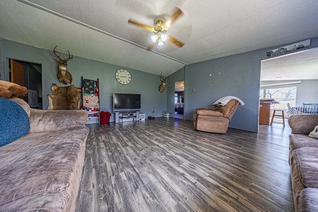15601 County Road 281, Wheatland, MO 65779 - living area with lofted ceiling, ceiling fan, a textured ceiling, and wood finished floors