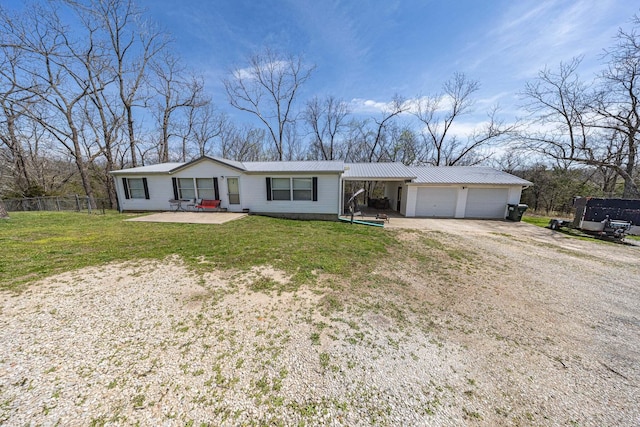 15601 County Road 281, Wheatland, MO 65779 - single story home featuring a front lawn, fence, metal roof, and driveway