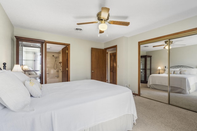 bedroom featuring a closet, light colored carpet, ceiling fan, and visible vents