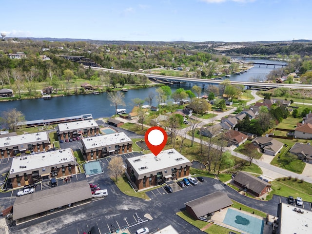 birds eye view of property with a water view