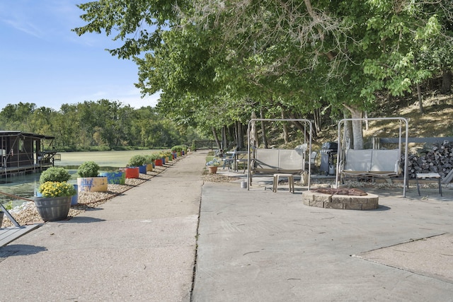 surrounding community featuring a fire pit