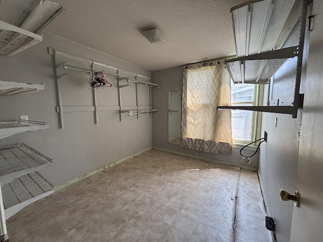 spacious closet with tile patterned floors