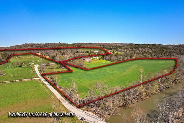birds eye view of property with a rural view