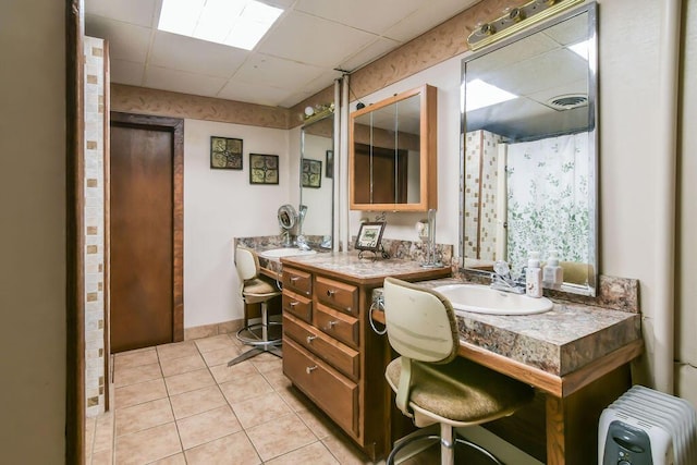 bathroom with visible vents, radiator heating unit, tile patterned flooring, and vanity