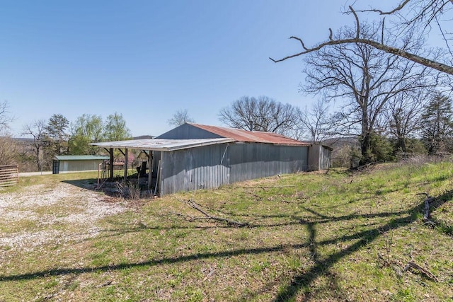 view of home's exterior featuring an outbuilding