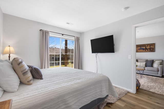 610 Abby Ln Unit 2, Branson, MO 65616 - bedroom featuring access to outside, wood finished floors, baseboards, and visible vents