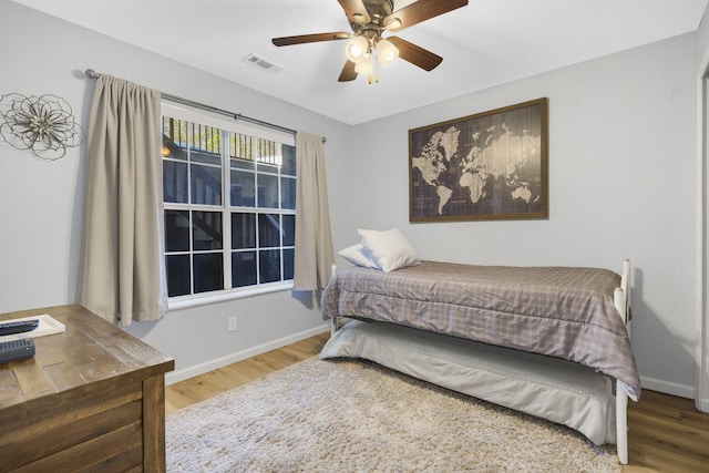 610 Abby Ln Unit 2, Branson, MO 65616 - bedroom with wood finished floors, ceiling fan, baseboards, and visible vents