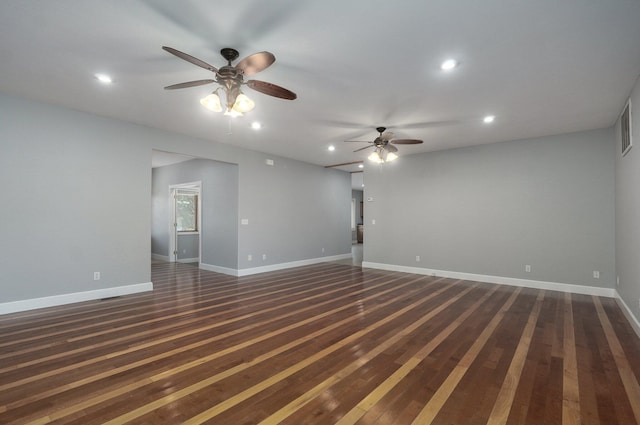 spare room with recessed lighting, dark wood-type flooring, baseboards, and ceiling fan
