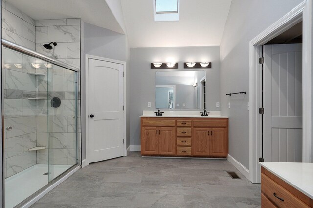 full bathroom with a sink, a shower stall, marble finish floor, and double vanity