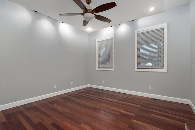 unfurnished room with baseboards, recessed lighting, dark wood-type flooring, visible vents, and ceiling fan