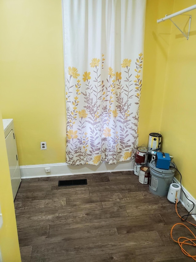2111 N Grant Ave, Springfield, MO 65803 - clothes washing area with visible vents, baseboards, laundry area, wood finished floors, and washer / dryer