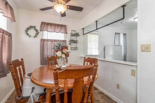 317 W 1st St, Miller, MO 65707 - dining room with ceiling fan and baseboards