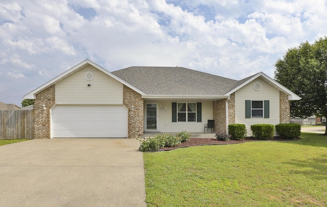 1431 Isdell St, Bolivar, MO 65613 - view of front of house featuring brick siding, driveway, and an attached garage