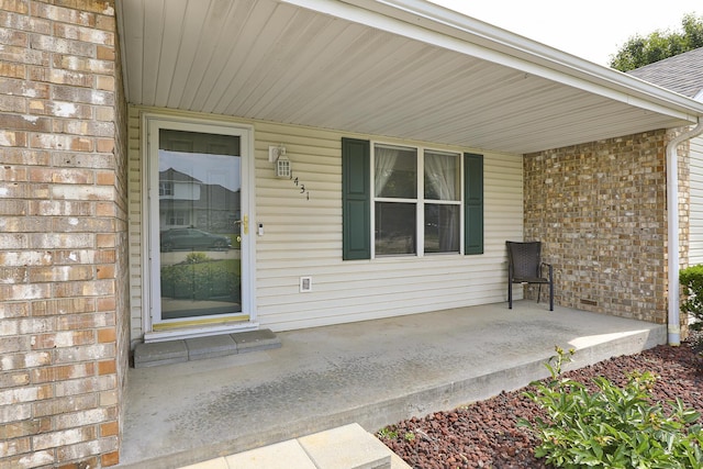 1431 Isdell St, Bolivar, MO 65613 - doorway to property with a porch and brick siding
