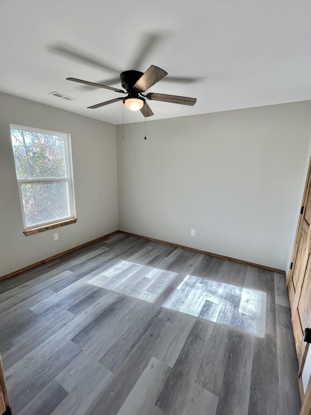 412 S Court St, Seymour, MO 65746 - empty room featuring visible vents, baseboards, a ceiling fan, and wood finished floors