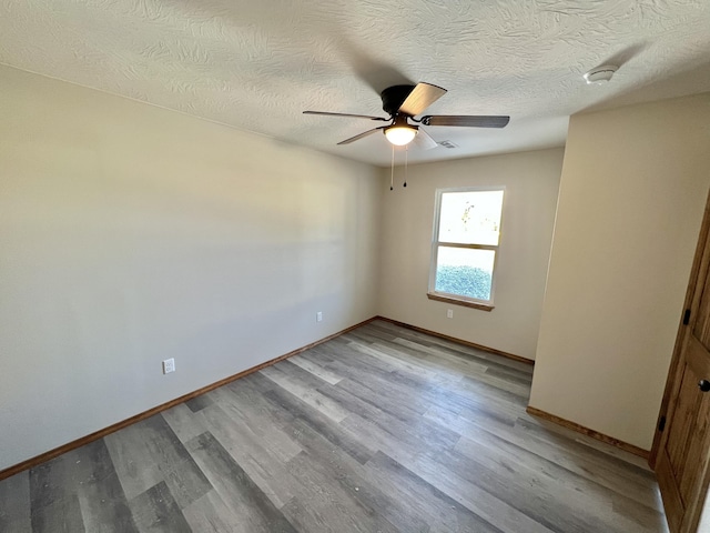 412 S Court St, Seymour, MO 65746 - spare room with light wood-style flooring, baseboards, and a ceiling fan