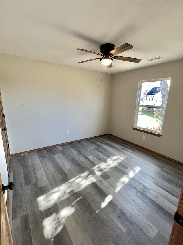 412 S Court St, Seymour, MO 65746 - spare room with visible vents, ceiling fan, wood finished floors, and baseboards