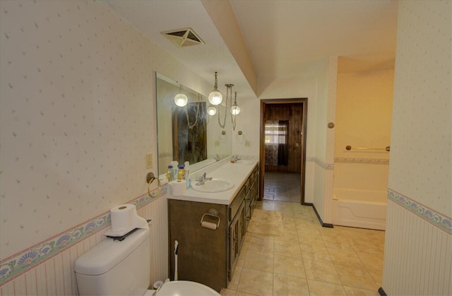 bathroom with tile patterned flooring, visible vents, toilet, a sink, and wallpapered walls