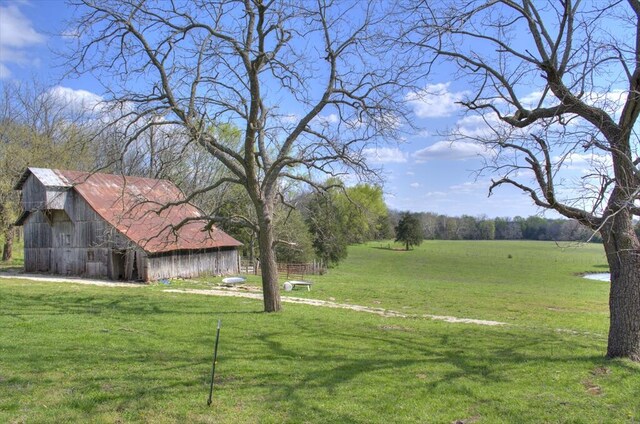 view of yard with a barn and an outdoor structure