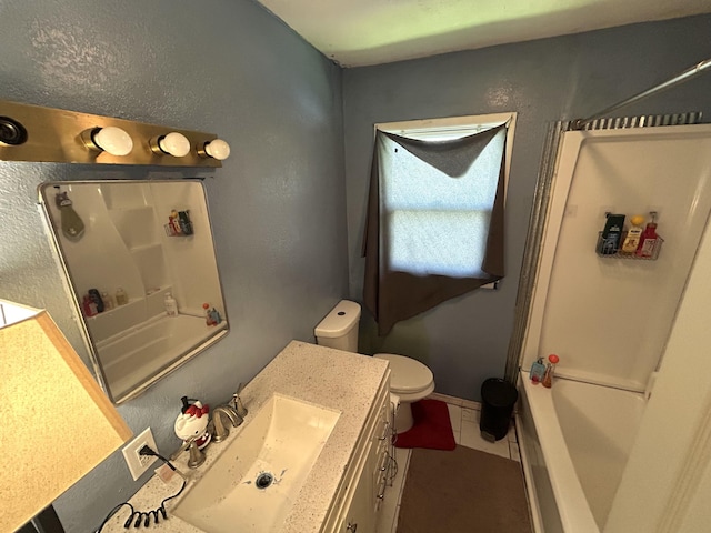 bathroom with toilet, vanity, bathtub / shower combination, and tile patterned flooring