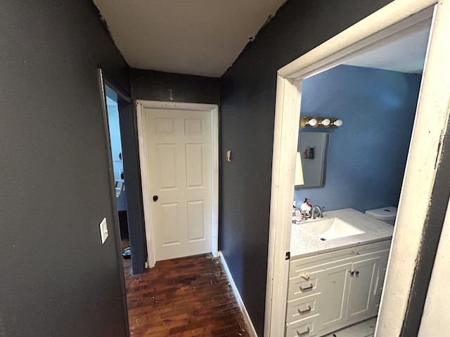 bathroom featuring vanity and wood finished floors