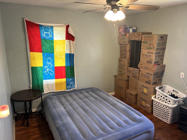 bedroom with a ceiling fan and wood finished floors