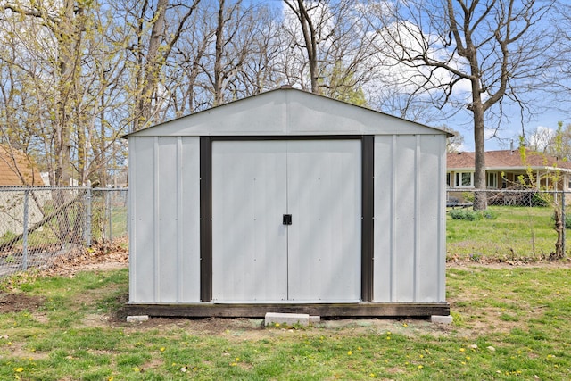view of shed with a fenced backyard