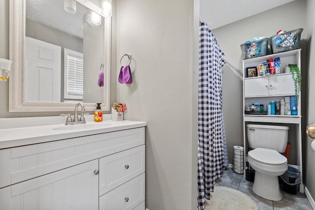 bathroom with tile patterned flooring, toilet, curtained shower, and vanity